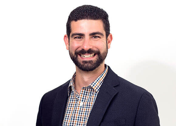 John Arcangelo '02 smiles for a photo.