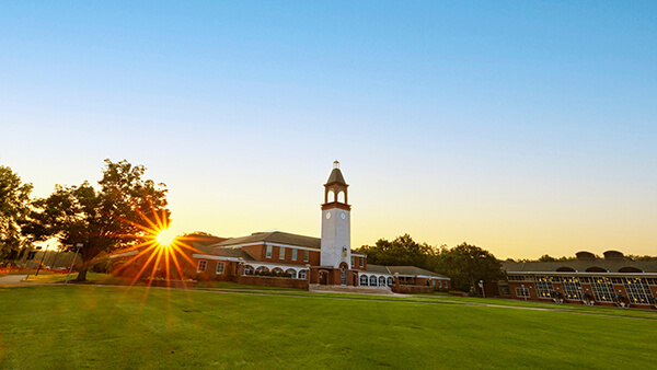 Mount Carmel Campus quad and Arnold Bernhard Library at sunrise