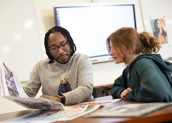 Teacher shows student a piece of text