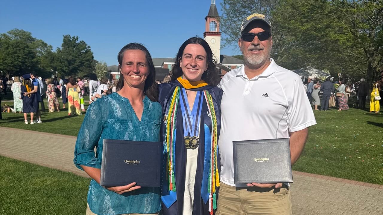 Jackie Grisdale poses with her parents at commencement