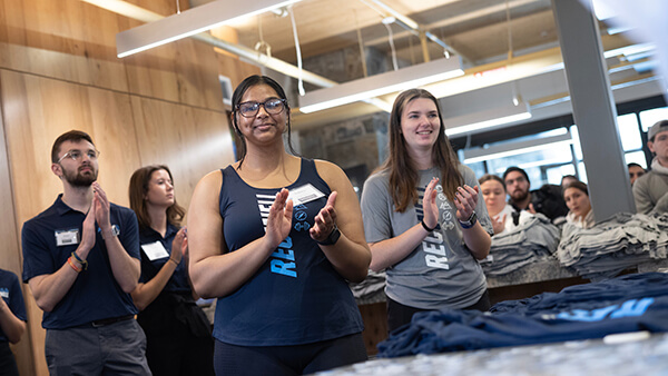 Students clap during the Recreation and Wellness Center grand opening.
