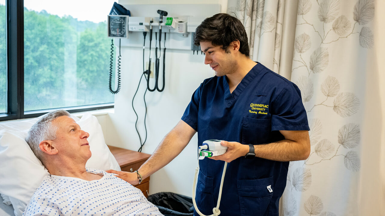 A nursing student consoles a standardized patient during an exercise in the simulation lab.