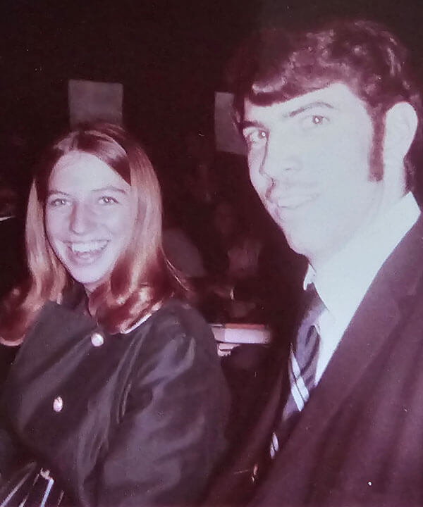Bob and Debbie Passero smile in a vintage photo