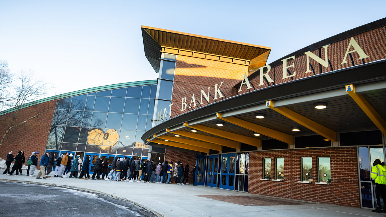 Individuals standing on line outside M&T Bank Arena