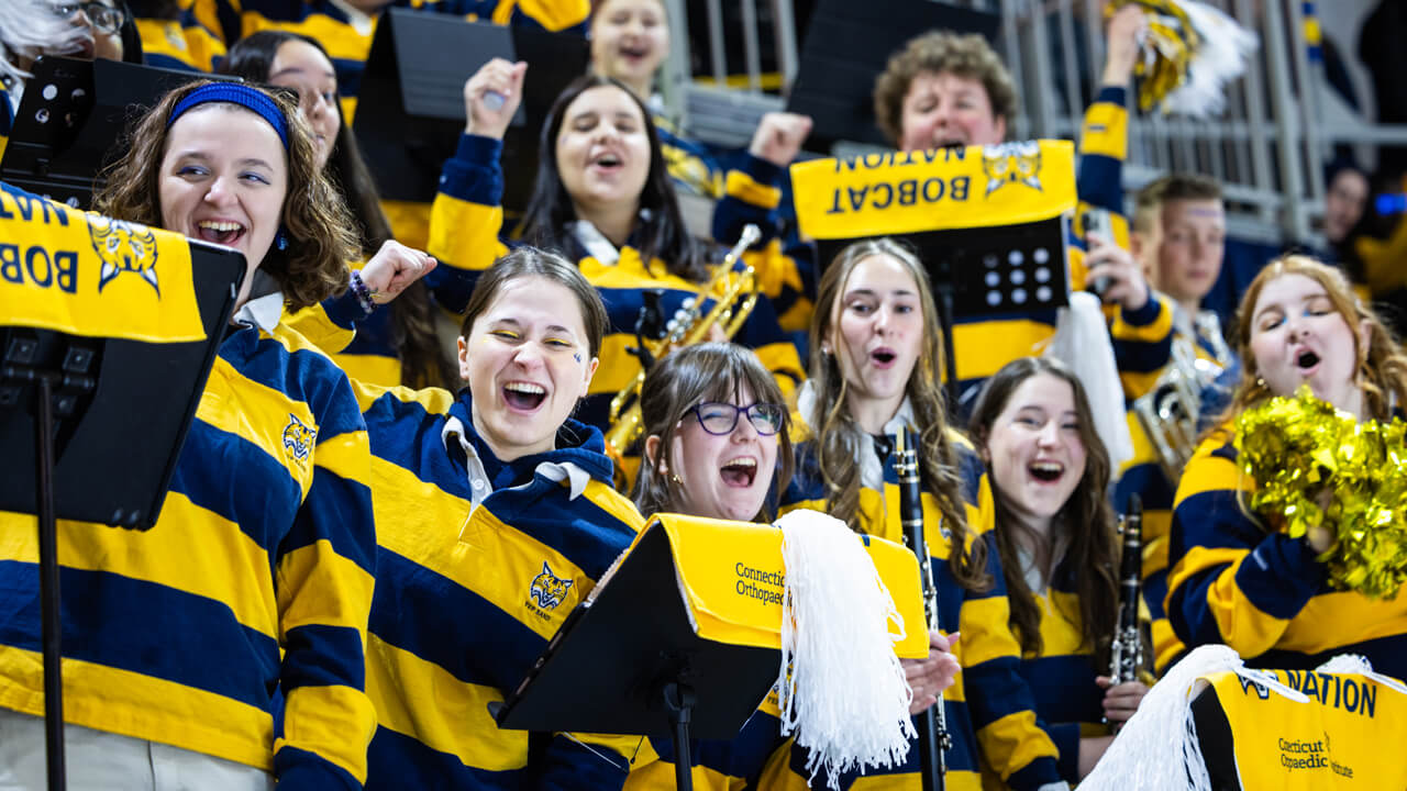 Members of the pep band cheering