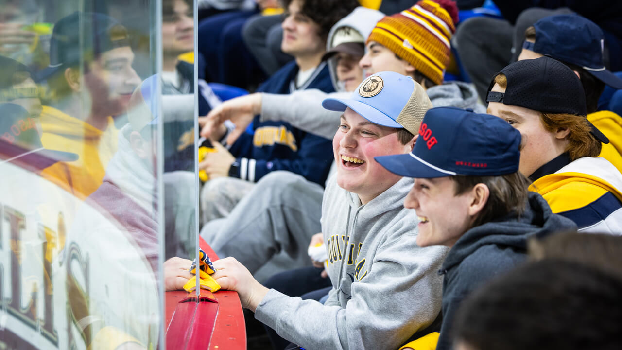 Individuals sitting behind the glass