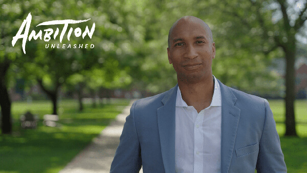 Austin Ashe stands outside on Quinnipiac's Mount Carmel Campus.