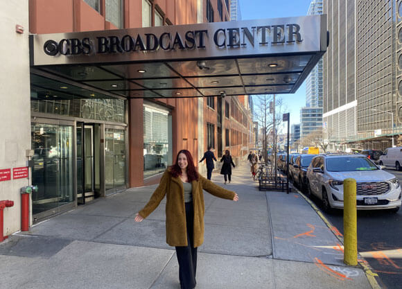 Person is standing in front of CBS broadcast center building