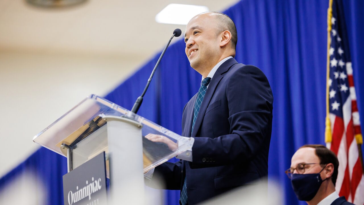 Steve Paik speaks at a podium during the Match Day celebration