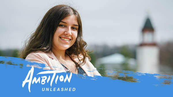 Jen McCue stands outside on the Mount Carmel Campus