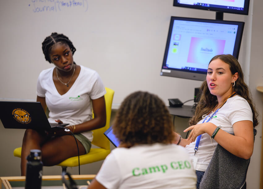 Members of the Girl Scouts association collaborate in a classroom