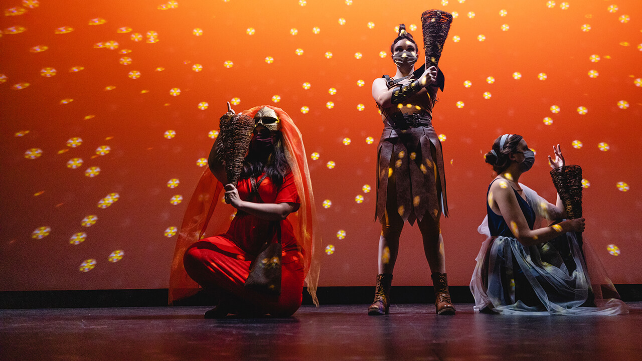 Students perform on stage.