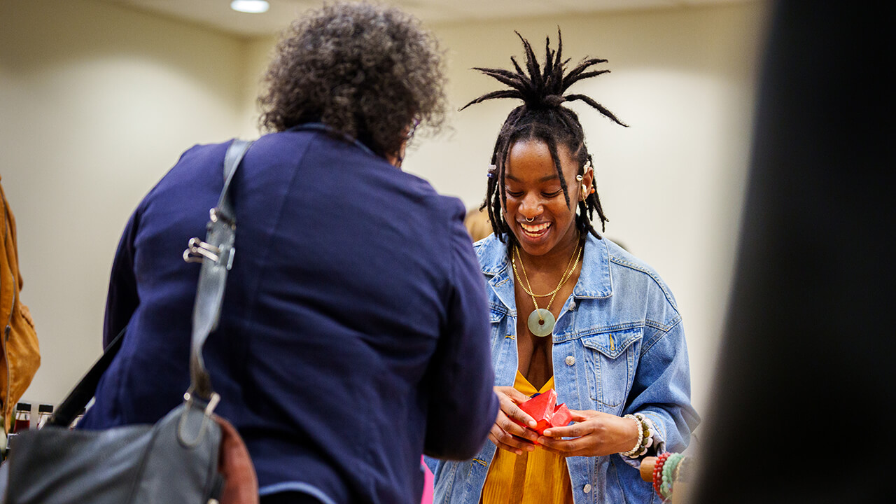 Small business owner showing products to a customer