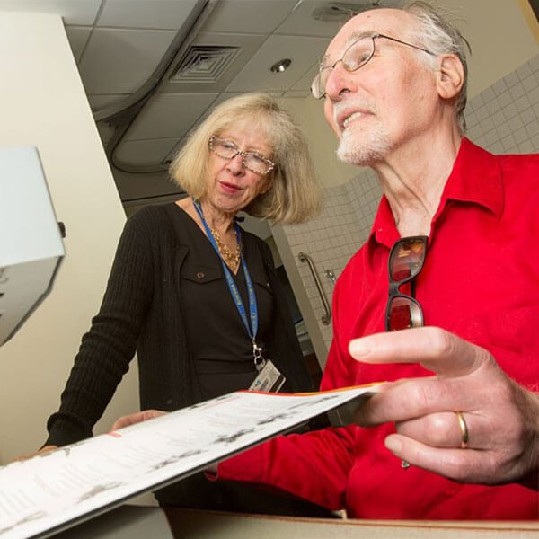 2 people looking at documents.