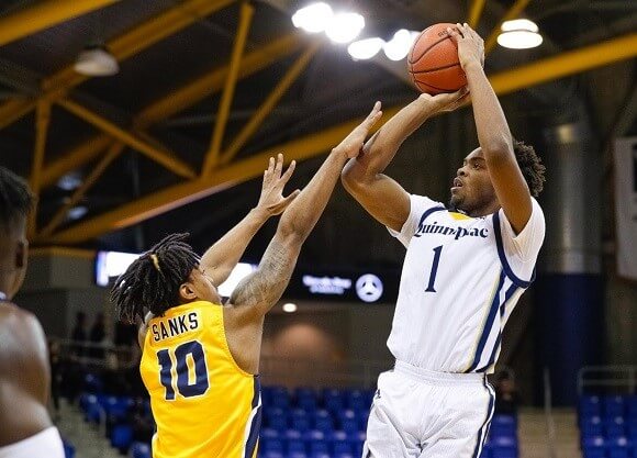Young shoots a basketball.