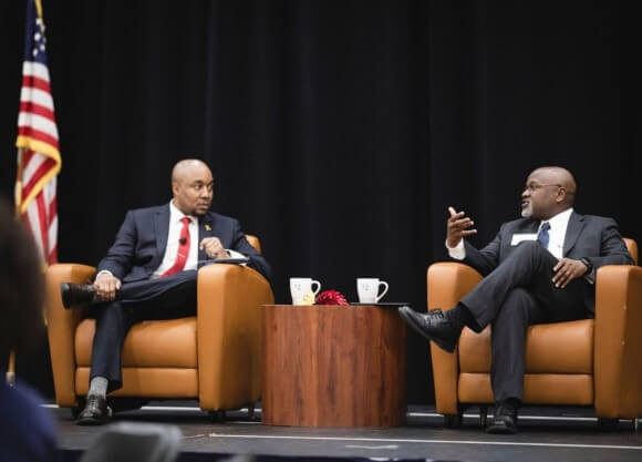 Two males have a discussion