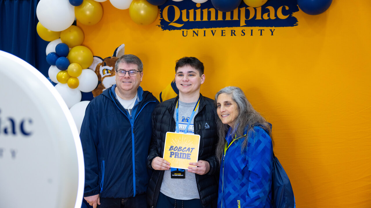 Individuals pose for a photo