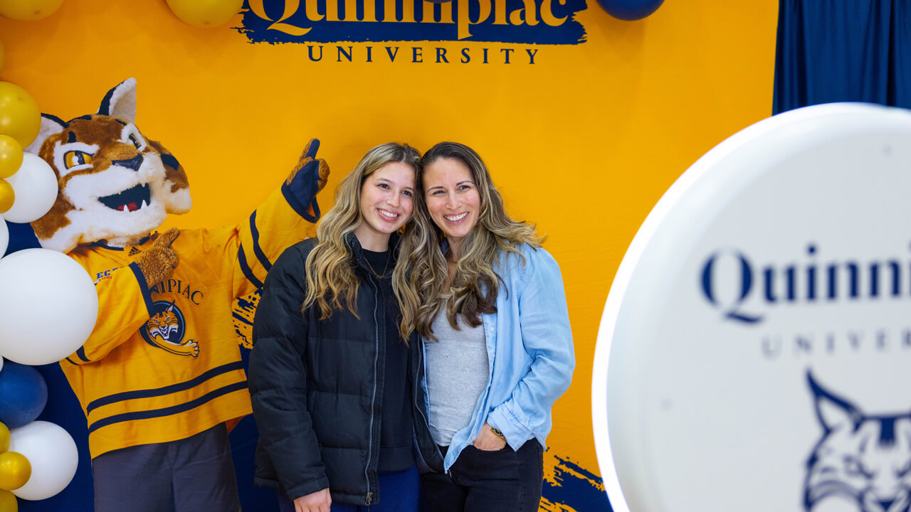 Individuals pose for a photo