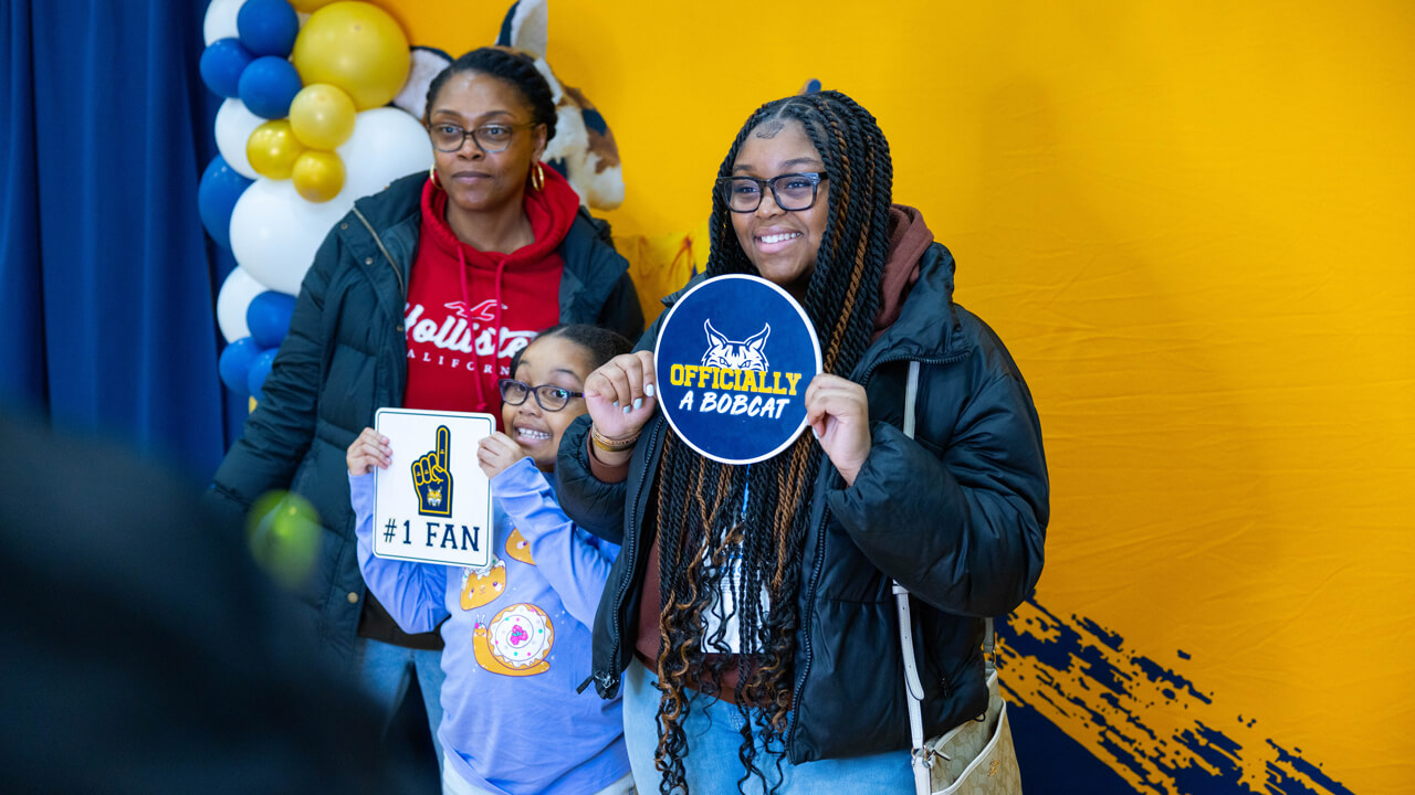 Individuals pose for a photo