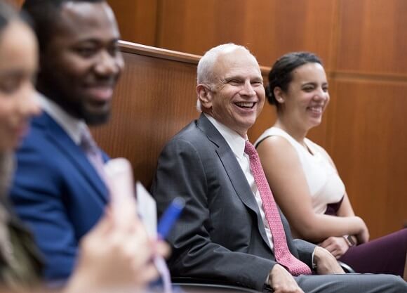 Koskoff smiles in his seat during the event.