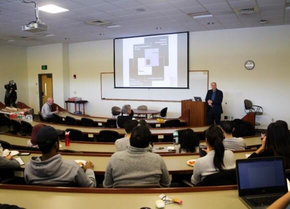 Students listen to lecture by Dr. Dan Bausch