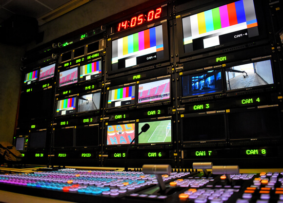 Screens with different images in a control room