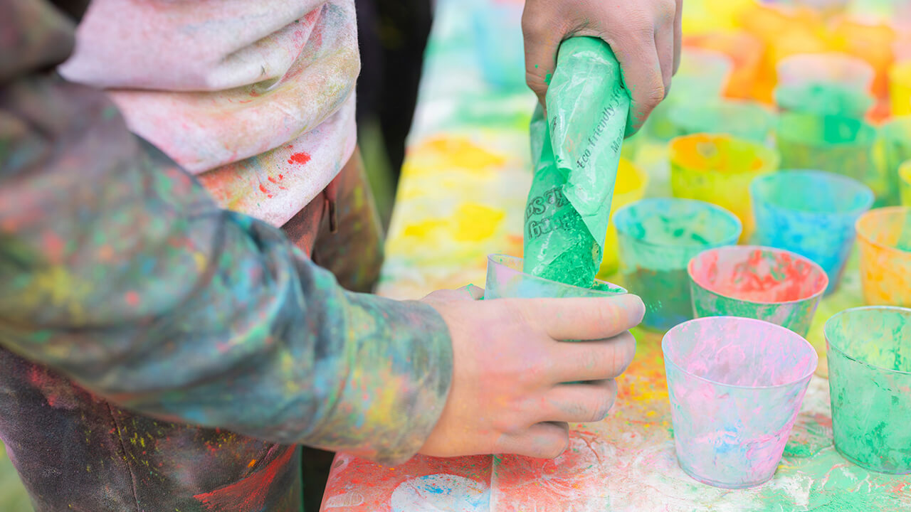 Pouring powder paint in cup