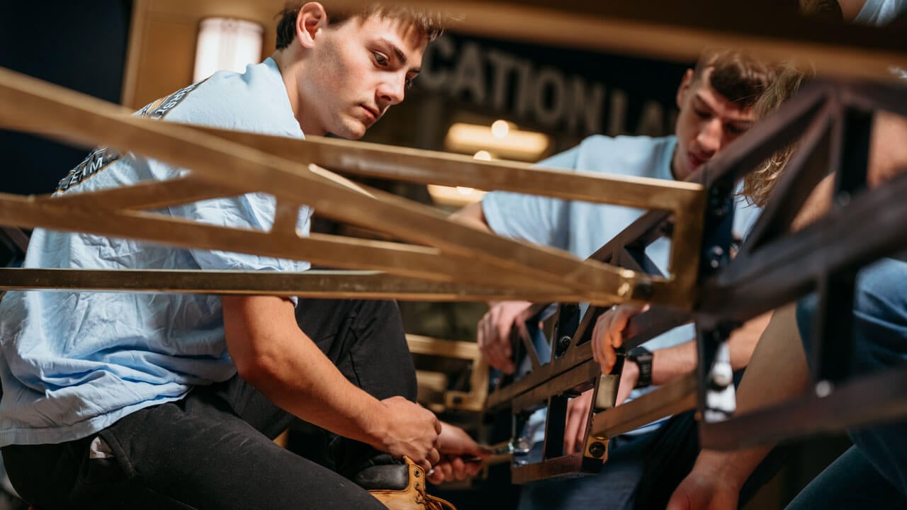 Student works on building a bridge