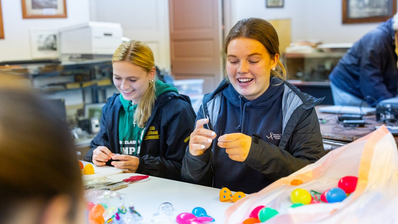 People organizing items at a table