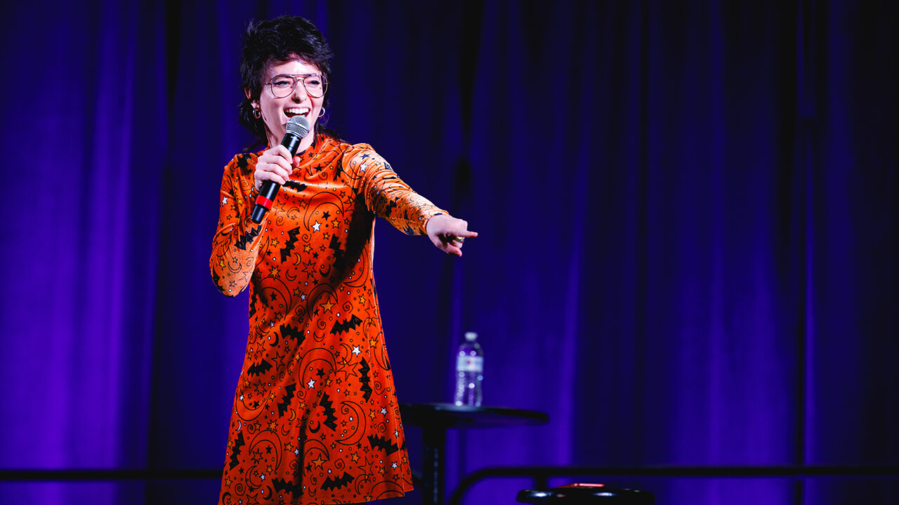 Sarah Sherman tells jokes from the stage.