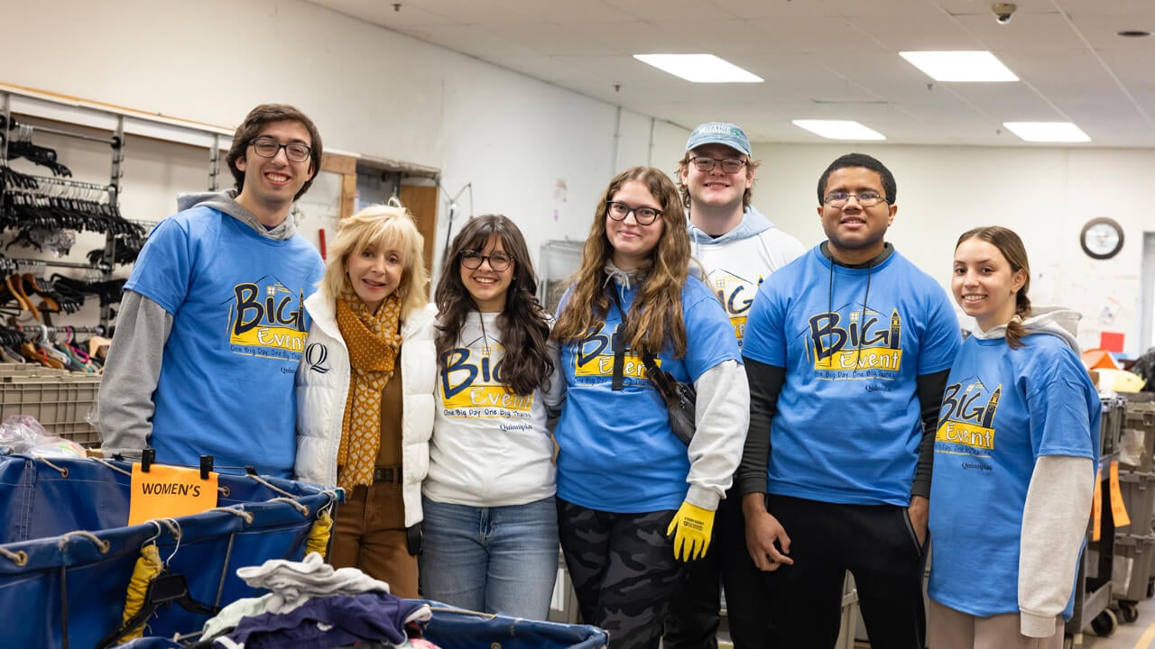 President Olian poses for a photo with The Big Event volunteers