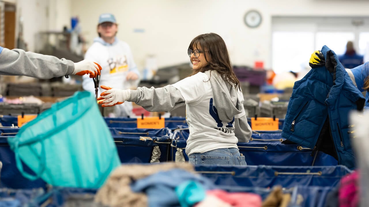 People sorting clothes