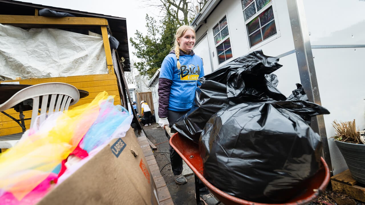 Person pushing a wheelbarrow