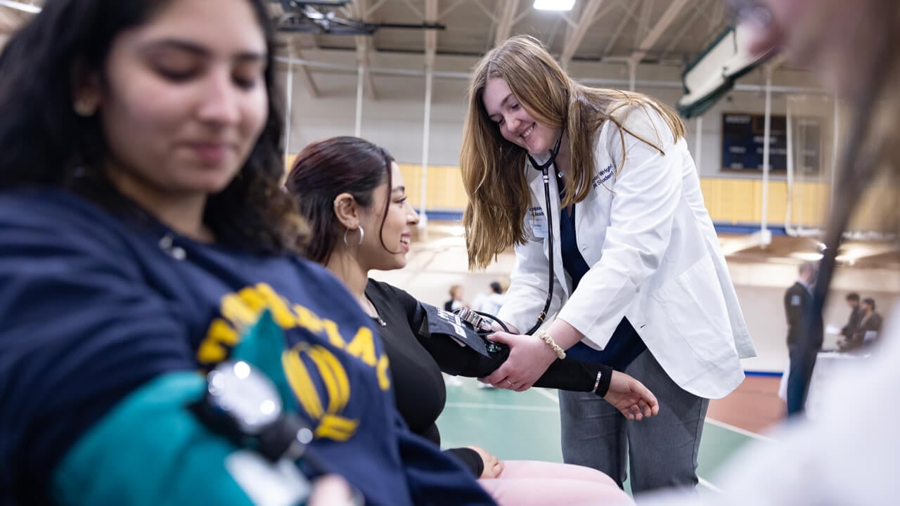 Individuals taking their blood pressure