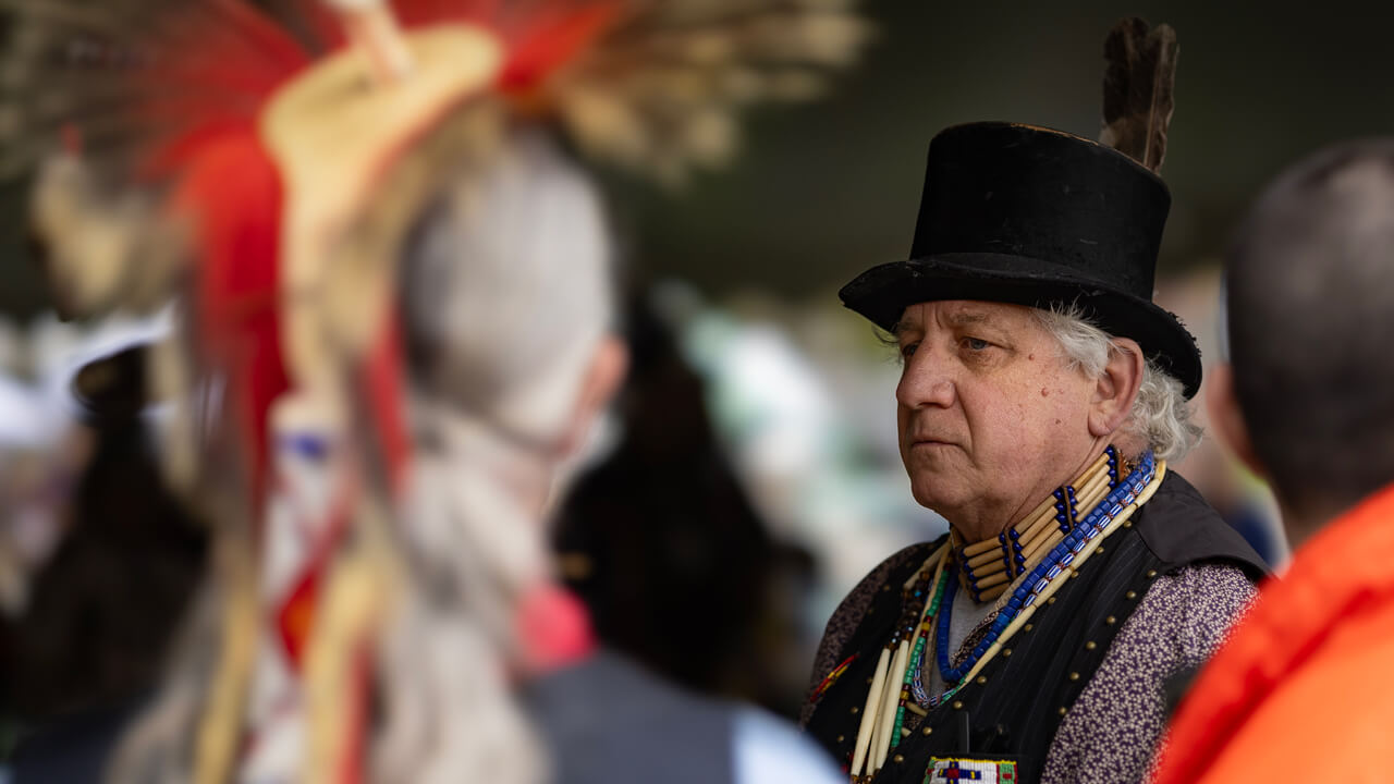 Person participates in powwow