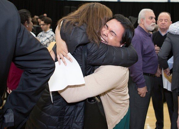 Medical students hug one another after being matched with their residency program