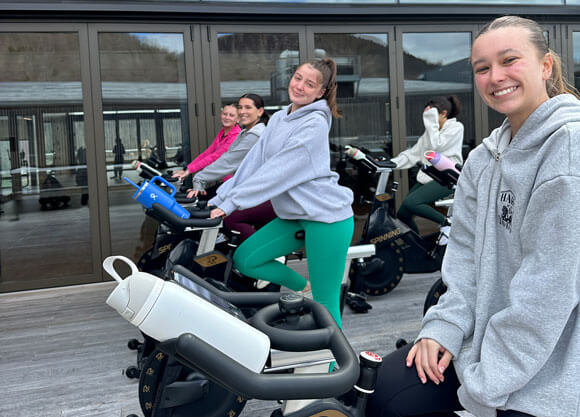 Students enjoy a spin class outside of the Recreation and Wellness Center.
