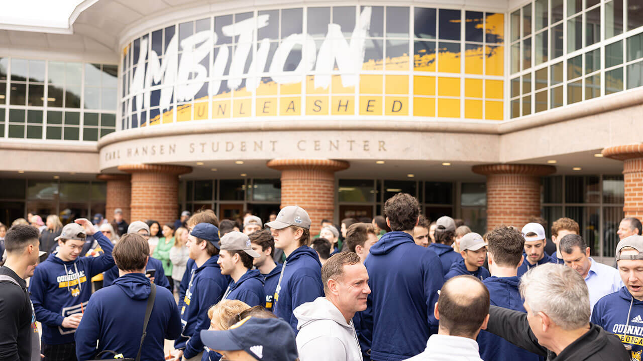 A crowd formed in front of the Carl Hansen student center for the national championship flag raising