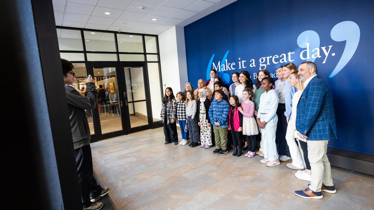 Students and teachers from the Side by Side Charter School in Norwalk, Connecticut take a group photo during the Kaleidoscope of Creativity event.
