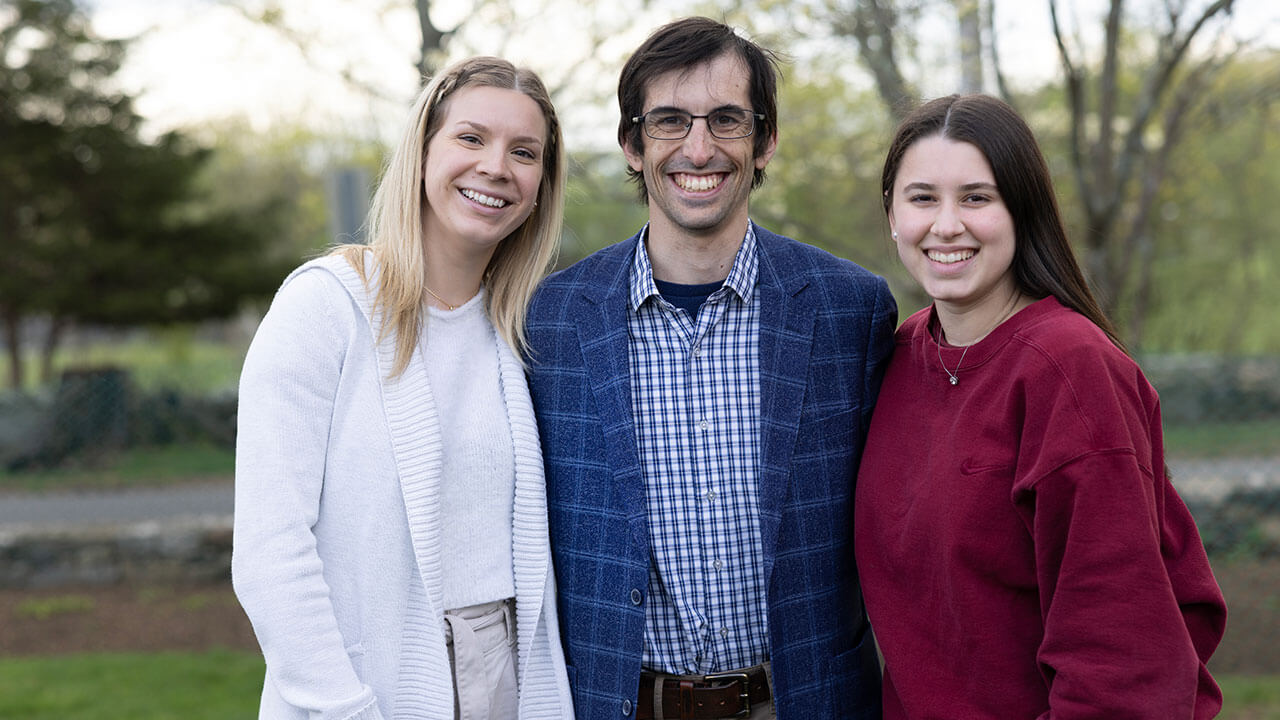 Students take a picture with a faculty member