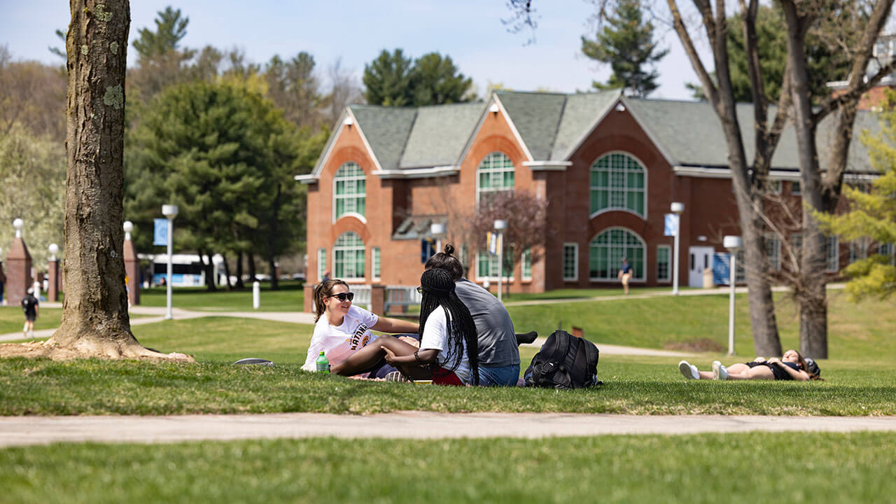 Students hang out on the Quad together on a Spring day