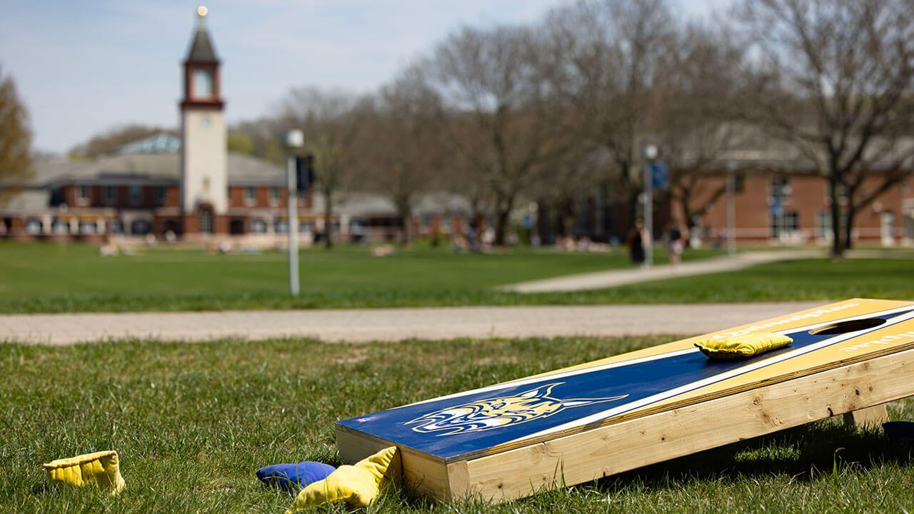A Quinnipiac branded corn hole set on the Quad