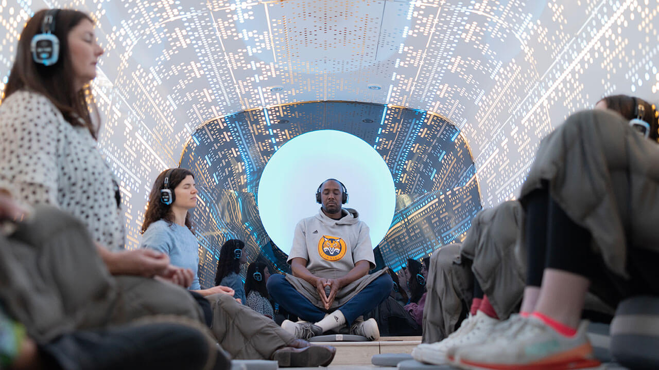 Students meditating with headphones on