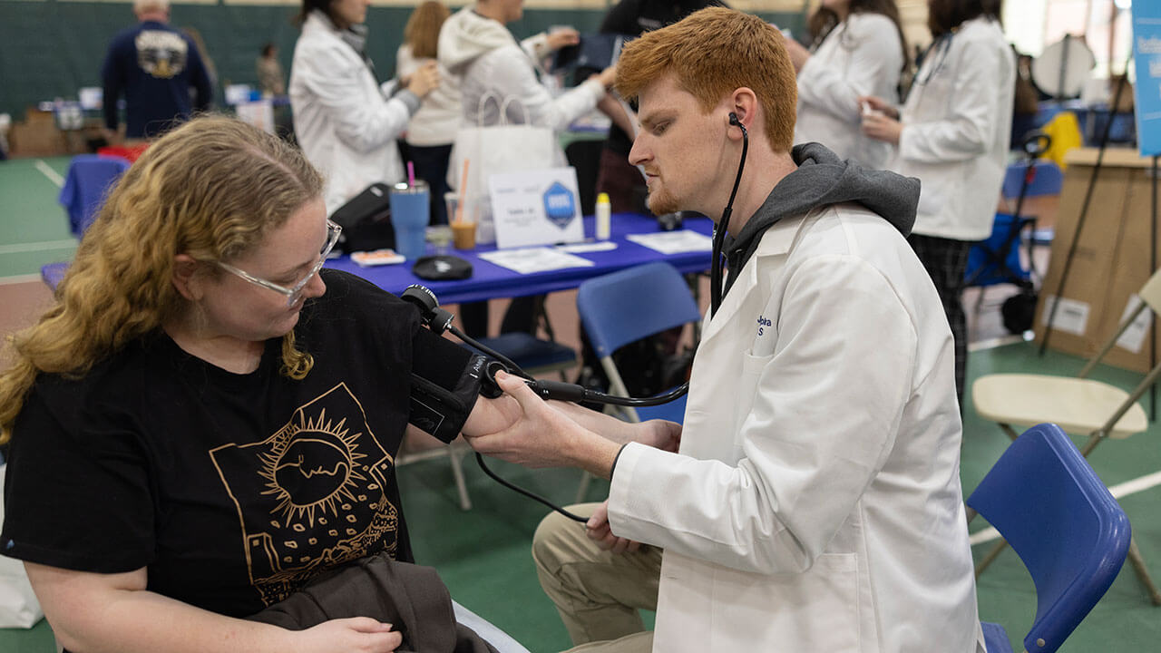 Student getting her blood pressure taken