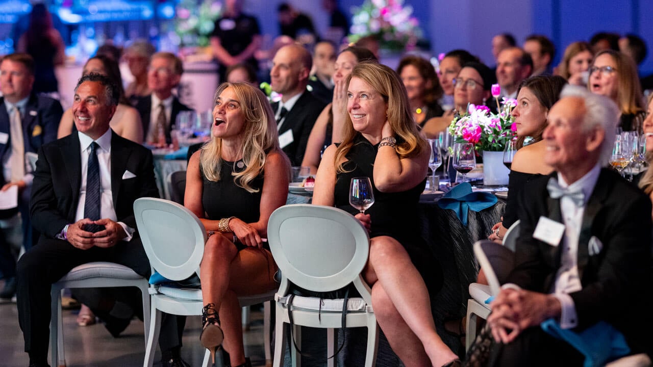 People smiling in the crowd