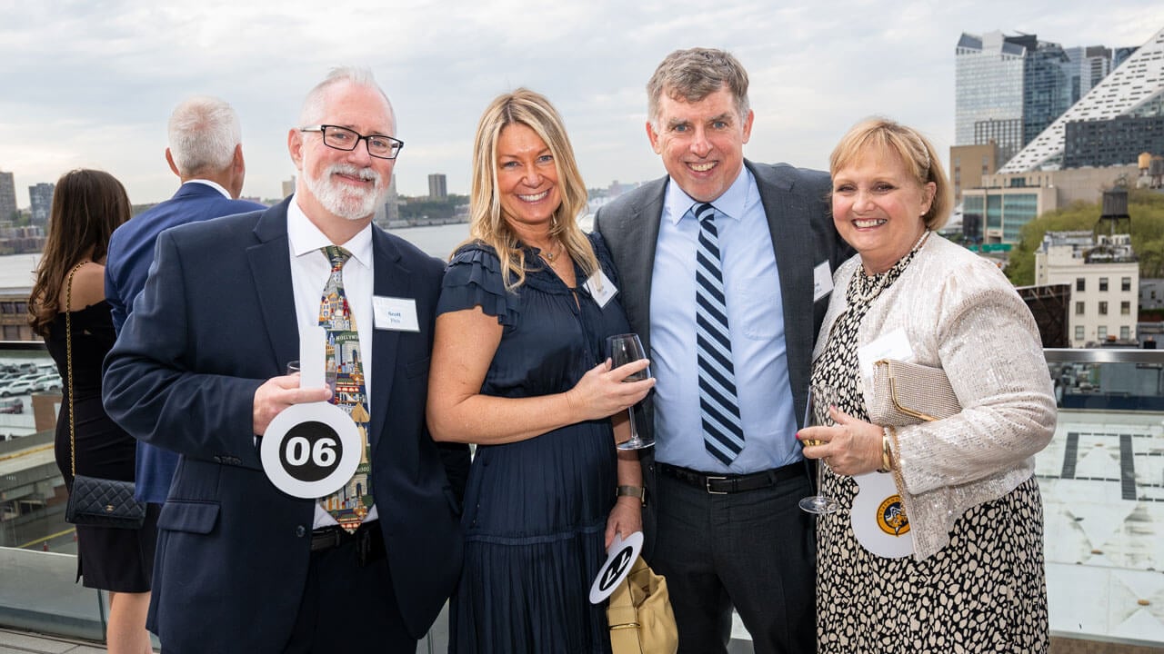 Four people pose for a photo