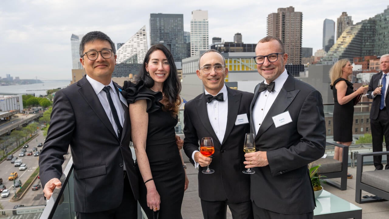 Four people pose for a photo