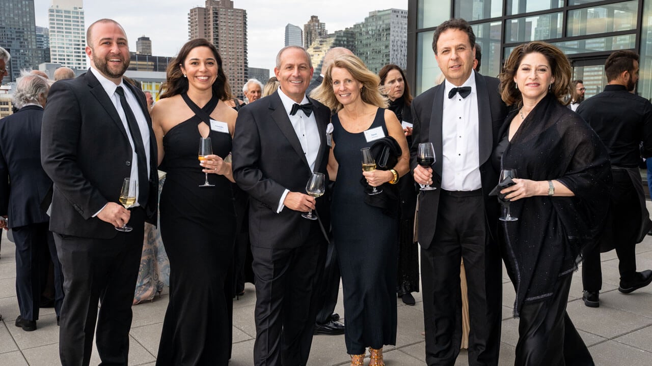 Six people pose for a photo