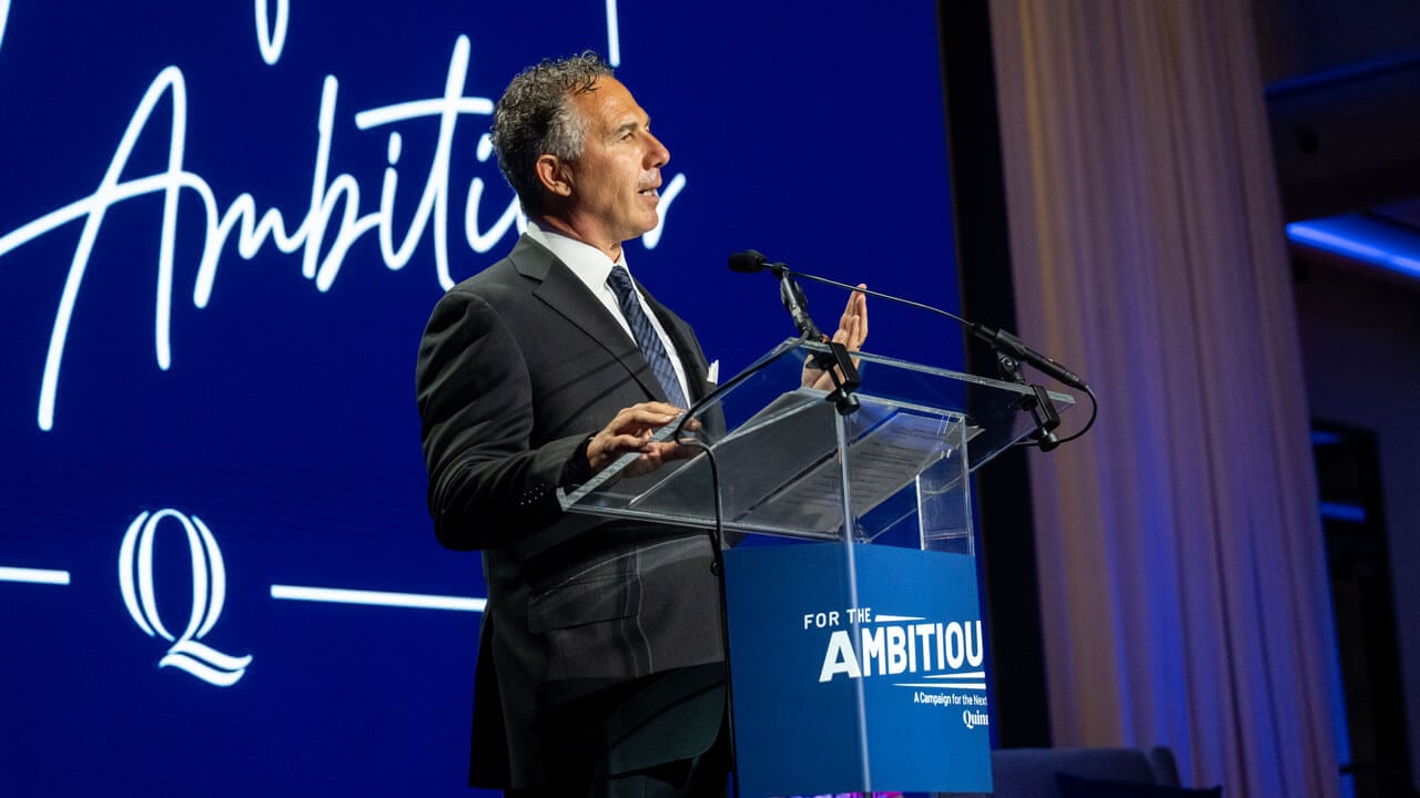 Chuck Saia speaking at the podium