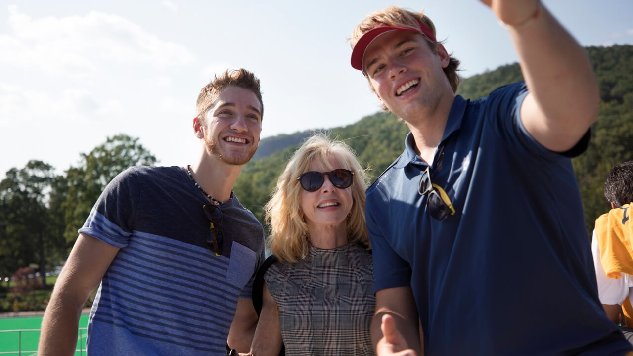 Judy Olian takes a selfie with students